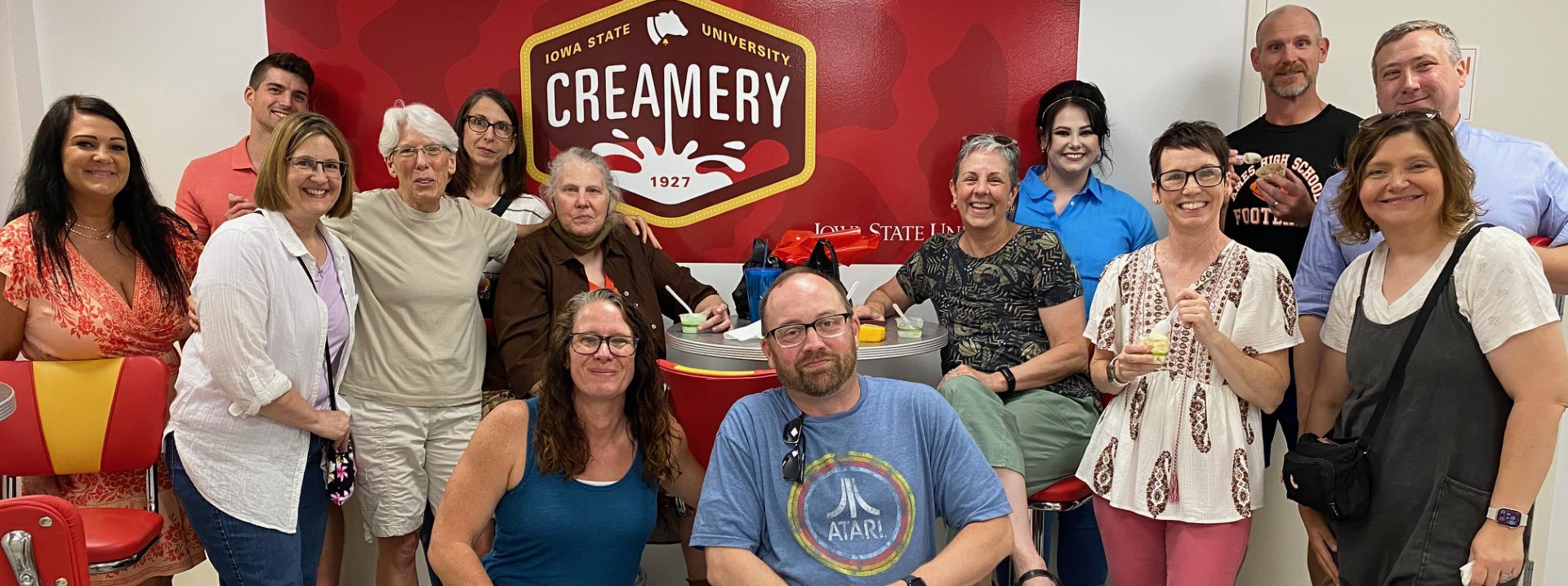 The FY24 Child Support contract team posing together at the ISU Creamery.