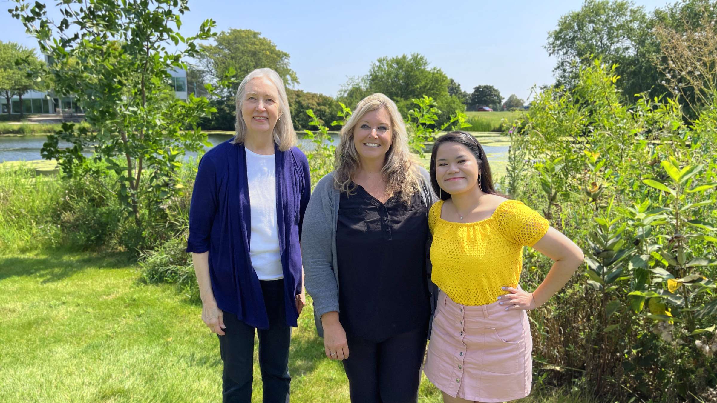 Dr. Janet Melby, Michelle Thorn, and Tin Cheong by the pond at Research Park.