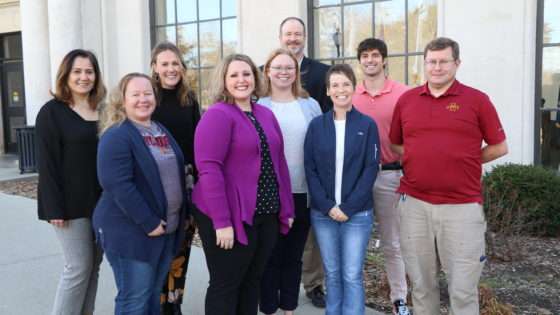 The 2022 Conference Planning Committee poses in front of the Memorial Union.