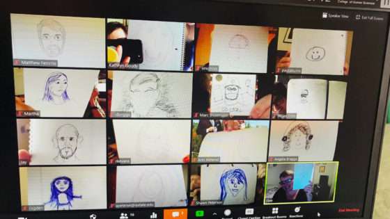 A screenshot from a Zoom meeting. Everyone is holding up pictures they drew as part of a team-building activity.