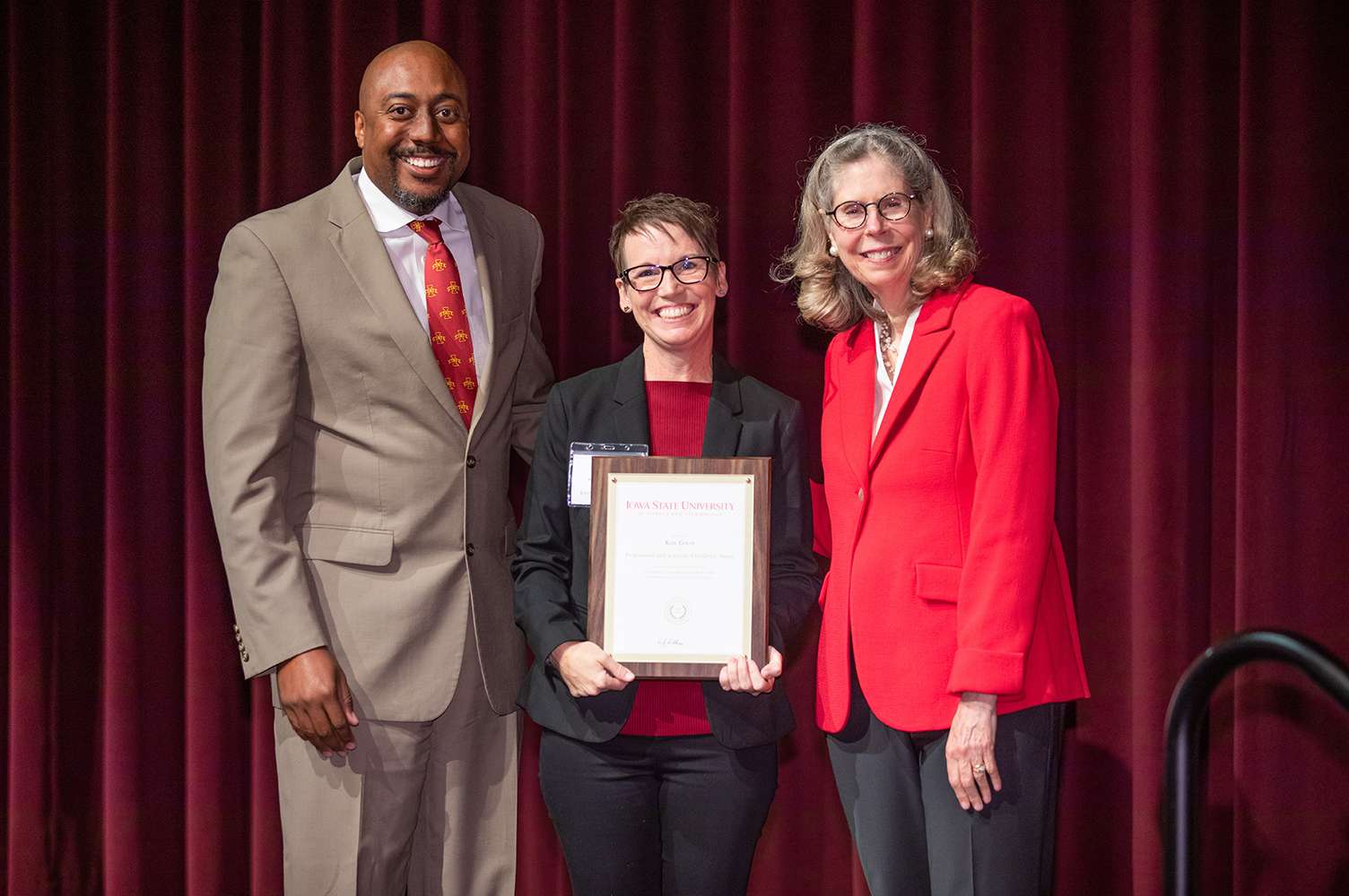 Pictured left to right are Shawn Norman, Kate Goudy, and Wendy Wintersteen. Kate is holding her award.